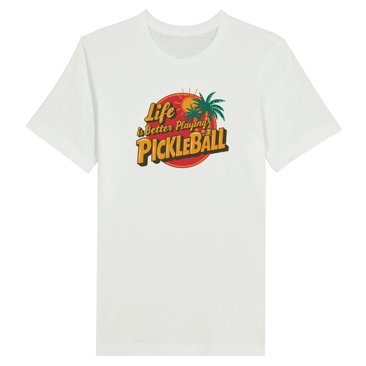Close-up of the “Life is Better Playing Pickleball” graphic on a light blue t-shirt, showing vibrant colors and palm trees.
